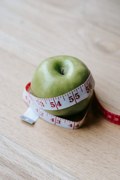 apple wrapped around measuring tape