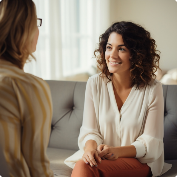 Happy woman smiling wile talking to her doctor for weight loss plan